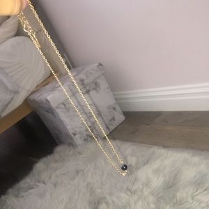 Necklace with a black ball